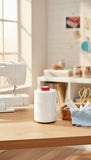 ACKERMANN AQUA wasserlösliches Nähgarn am Tisch mit Nähmaschine